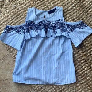 Boutique shirt! Open shoulders with embroidery on the front. Size xs.